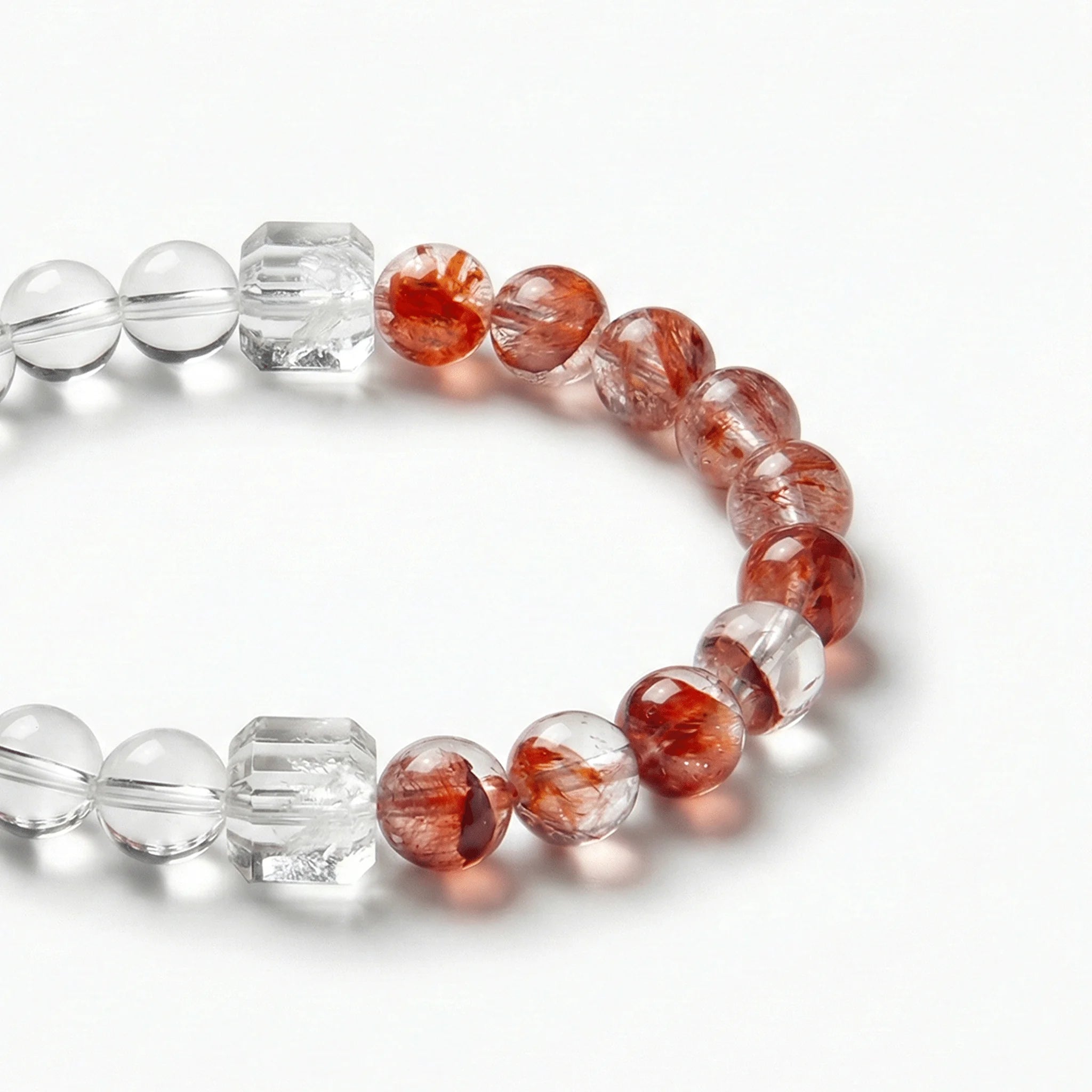 Bracelet en perles d'hématite rouge et de quartz clair